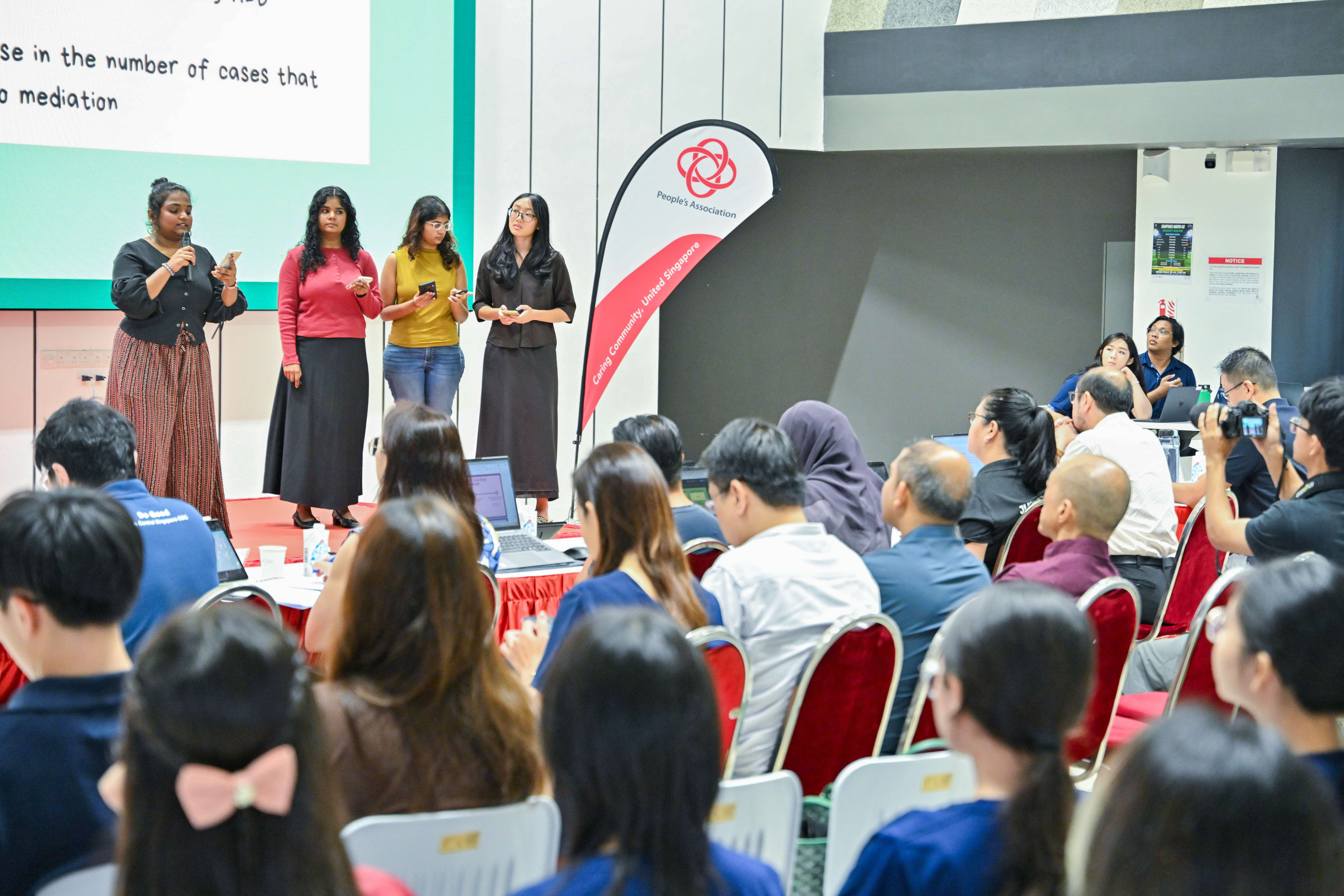 Four students explaining to the audience and panel